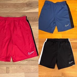 3 pairs of Nike Kids soccer shorts,  3 pairs: Black, Blue and Red size XL